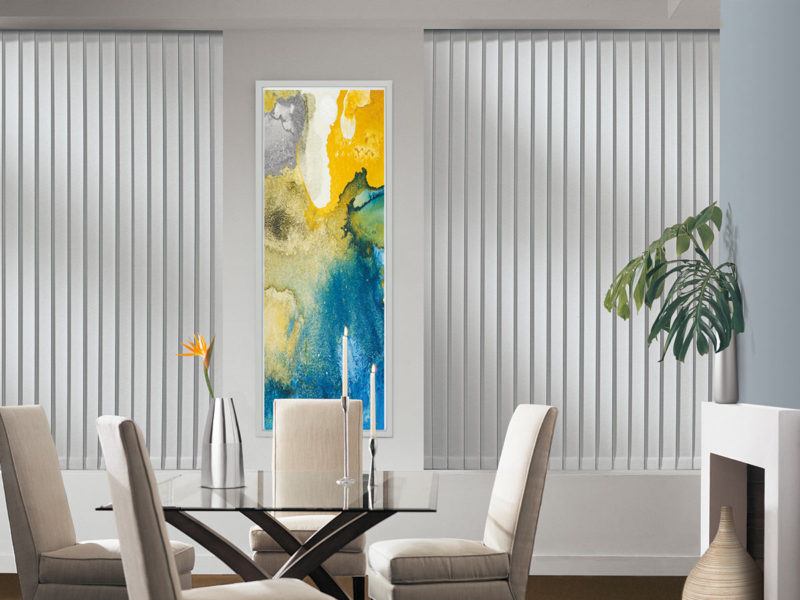 a dining room with Hunter Douglas somner vertical blinds