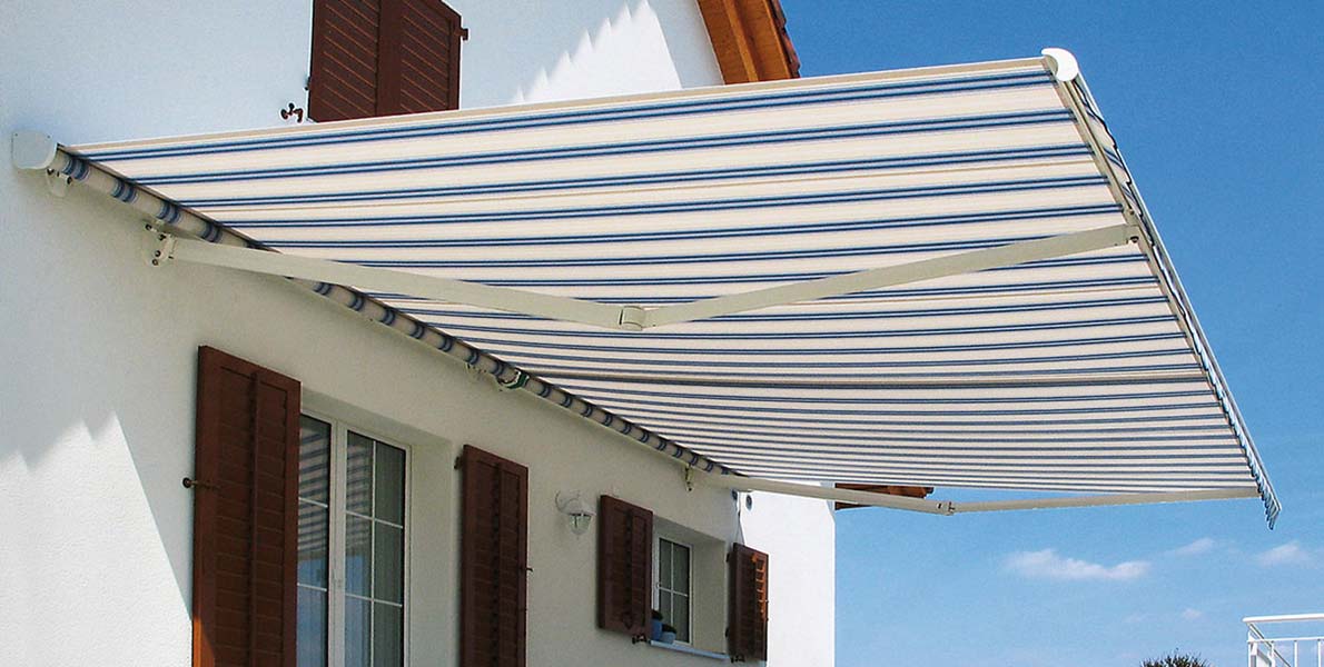 Sunshade Blinds & Drapery awning with blue pin-stripes