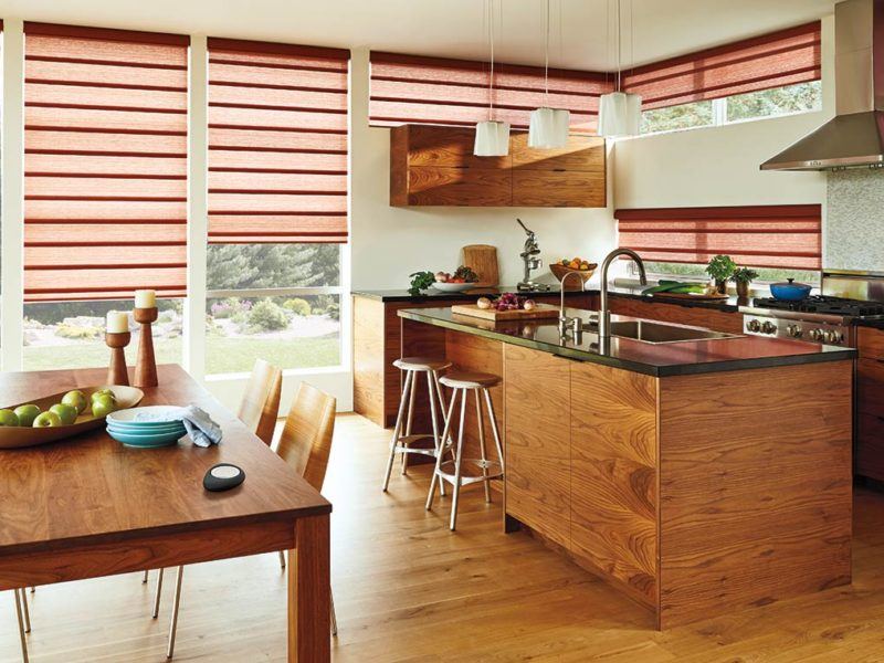 Vignette® roman shades featured in a kitchen white wooden cabinetry