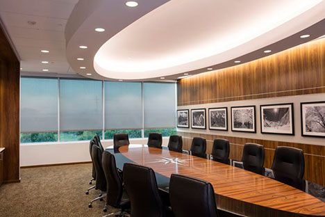 a meeting room with a large office table