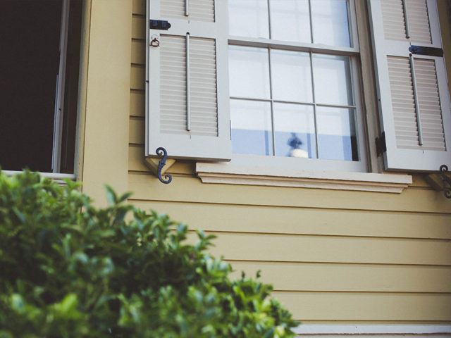 exterior shutters around windows of house