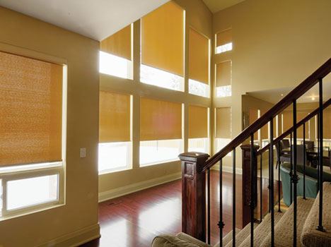 Hunter Douglas blinds in a large living room with large windows