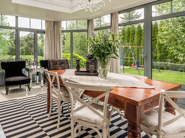 a dining room with a table and chairs